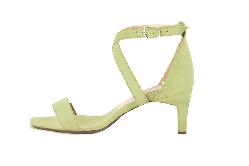 Women's  elegant sandals closed at the back with crossed straps. .  - Profile view